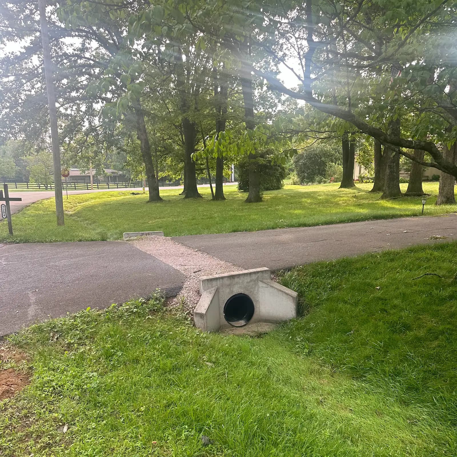 Concrete culvert installed beside a residential road