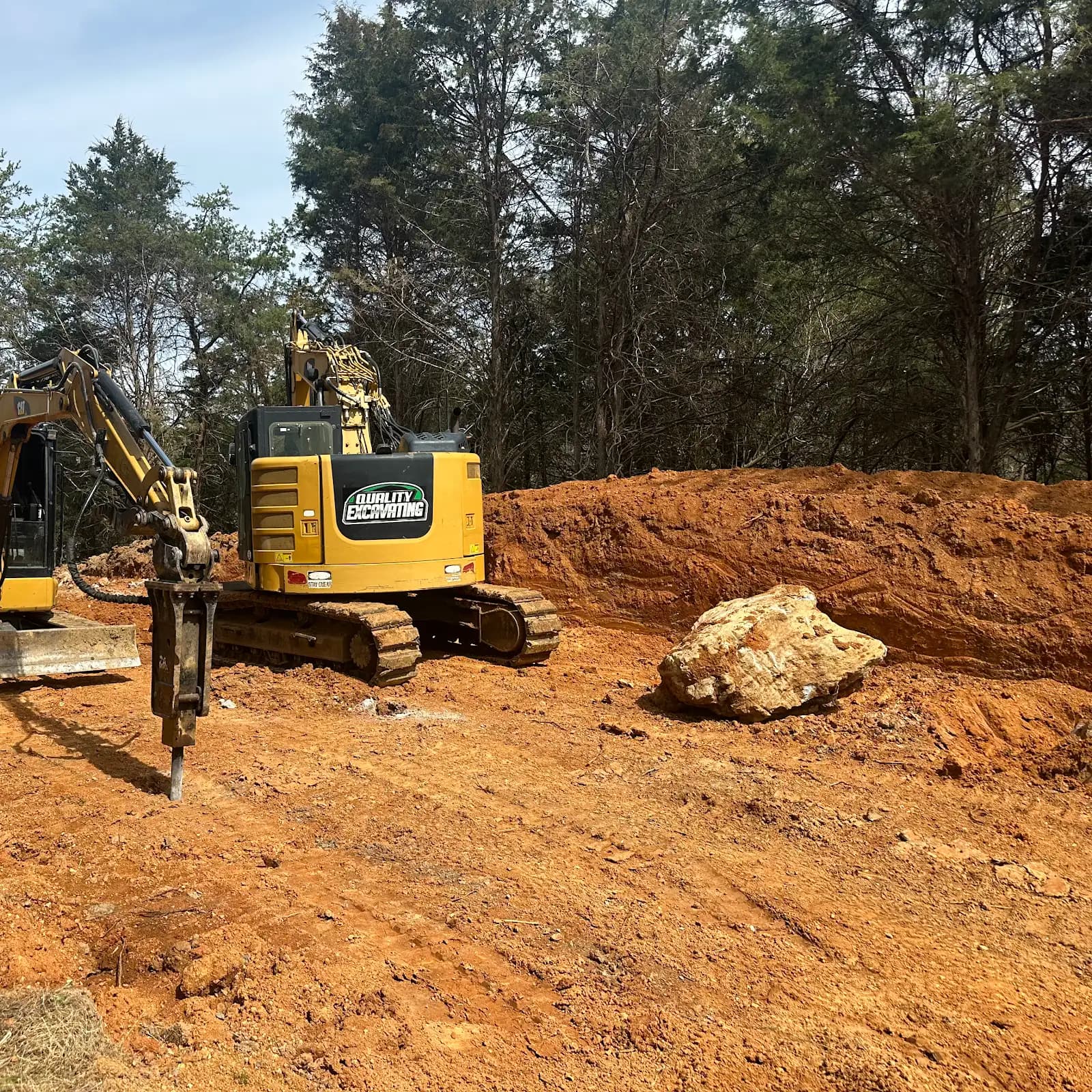 Heavy equipment positioned for earthwork and material removal